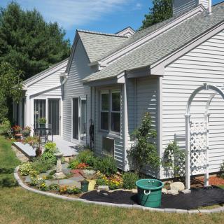 A suburban house with a well-maintained garden and yard.