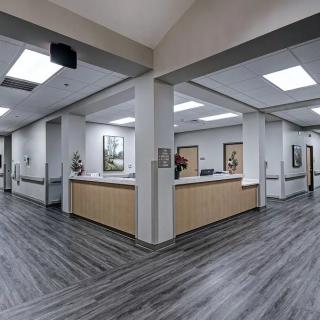 A modern office reception area with a spacious hallway and contemporary design elements.