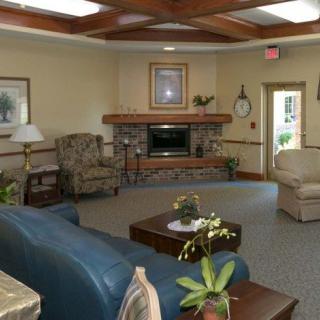A cozy living room with comfortable seating and a fireplace.