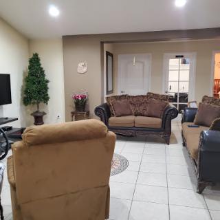 A cozy living room featuring comfortable seating and modern decor.