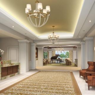 Elegant hotel lobby with chandeliers and comfortable seating.