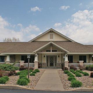 A single-story house with a pitched roof and well-maintained landscaping.