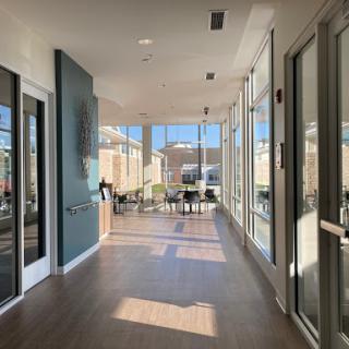 A bright and modern lobby with large windows, showcasing a spacious design.