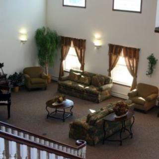 A spacious living area with comfortable seating and elegant decor.