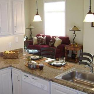 Open-plan kitchen and living area with modern furnishings.