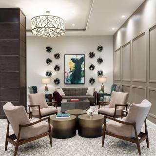 A modern and luxurious living room with stylish furniture and decor.