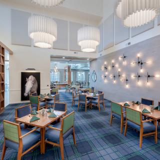 A modern restaurant dining area with stylish furniture and unique lighting designs.