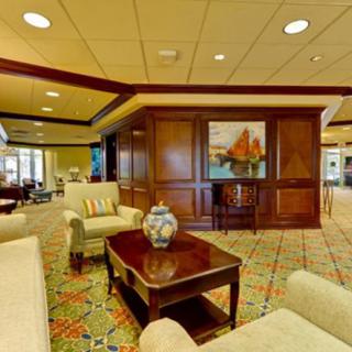 A spacious and elegantly decorated hotel lobby with comfortable seating and stylish decor.