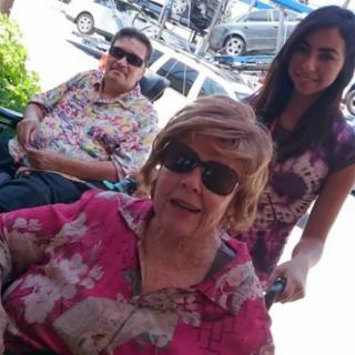Group of people enjoying a sunny day outside.