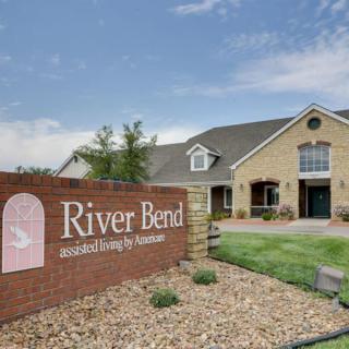 Front view of River Bend Assisted Living by Americare with landscaped grounds.