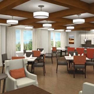 A modern dining area with neatly arranged tables and chairs, featuring contemporary lighting and decor.