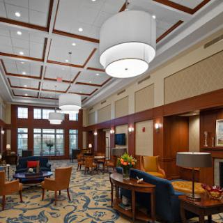A modern and inviting lobby space with elegant lighting and comfortable seating.