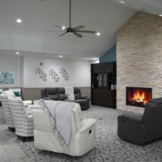 A stylish and inviting living room featuring a cozy fireplace, modern furniture, and a relaxing ambiance.