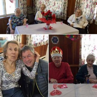 A joyful celebration with seniors gathered around a table, featuring festive decorations and a crowned individual sharing smiles with family.