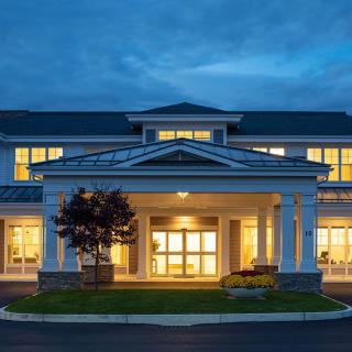 A well-lit residential building entrance at night.