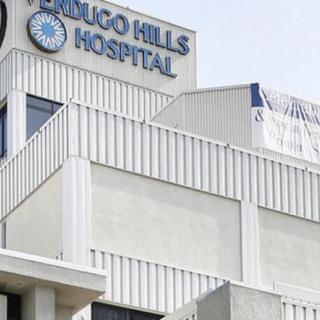 A view of the exterior of a hospital building with visible signage.