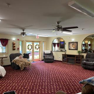 A spacious living area featuring comfortable recliners and decorative elements.