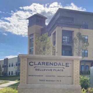 A view of Clarendale Bellevue Place with a clear blue sky in the background.