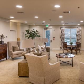 A cozy and elegantly furnished living room with comfortable seating and tasteful decor.