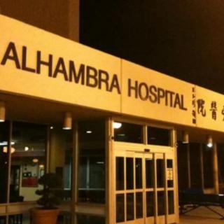 Night view of Alhambra Hospital entrance.