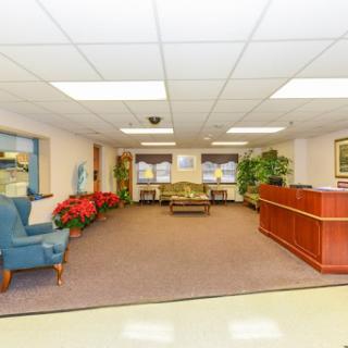 A welcoming lobby designed for comfort and relaxation, featuring seating arrangements and decorative plants.