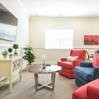 A bright and cozy living room with modern furnishings and decorative elements.