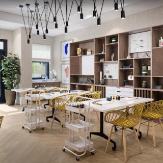 A modern workspace featuring sleek furniture, open shelving, and contemporary lighting.