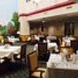 Elegant restaurant dining area with neatly arranged tables and chairs.