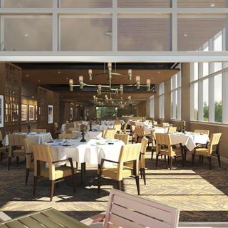 A well-lit restaurant dining area with neatly arranged tables and chairs, featuring large windows and elegant chandeliers.