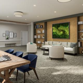 A modern living room with elegant furnishings, featuring a large artwork piece and a spacious dining area.