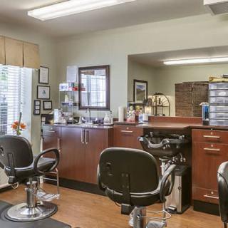 A well-organized barbershop with multiple chairs and haircut stations.