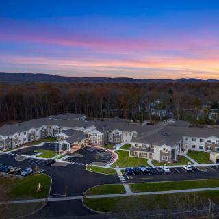 Aerial view of a residential apartment complex at sunset.