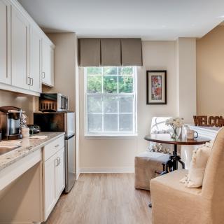 A cozy kitchen and dining area in a small apartment with modern design elements.