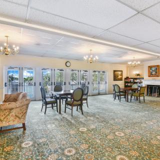 A spacious lounge area with elegant furnishings and ample natural light.