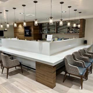 A modern bar and lounge area featuring sleek design and comfortable seating.