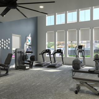 A modern gym equipped with treadmills, a stationary bike, and other exercise equipment.