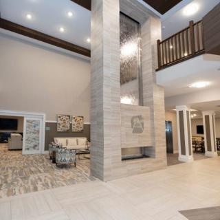 A modern and spacious lobby area featuring contemporary design elements and elegant furniture.