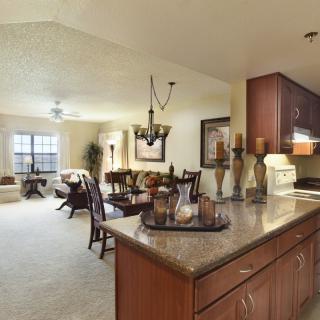 A spacious open floor plan featuring a modern kitchen and dining area with stylish decor.