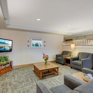 A cozy living room with comfortable seating and a television.