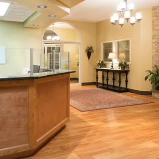 A welcoming lobby with a reception desk and elegant lighting.