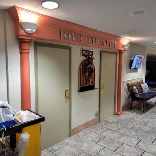Entrance to a themed area within a building, featuring decorative columns and signage.