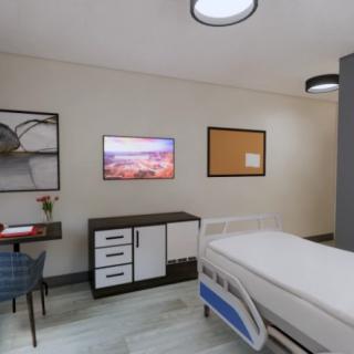 Modern hospital room with a bed and television.