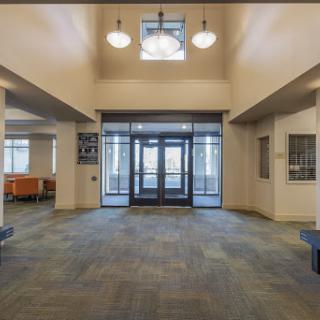 A spacious and well-lit lobby area featuring a modern entrance.