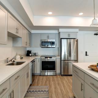 A modern kitchen with stainless steel appliances and sleek cabinetry.