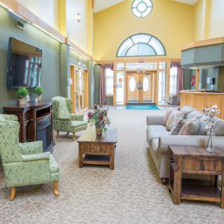 A spacious and inviting lobby featuring comfortable seating and ample natural light.