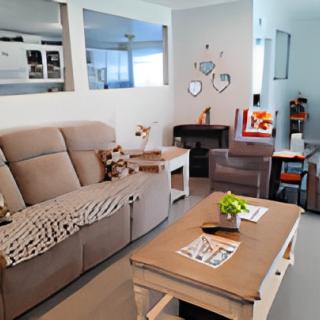A cozy and modern living room with a comfortable sofa, coffee table, and decorative elements.