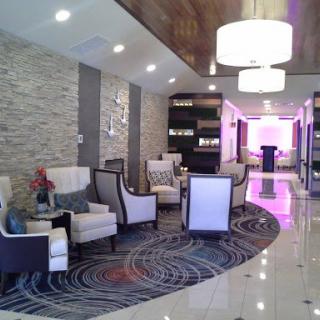 A modern hotel lobby featuring stylish seating and contemporary lighting.
