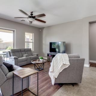 A modern living room with comfortable sofas, a television, and stylish decor.