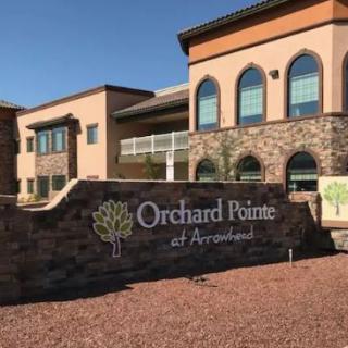 Exterior view of Orchard Pointe at Arrowhead with prominent signage.