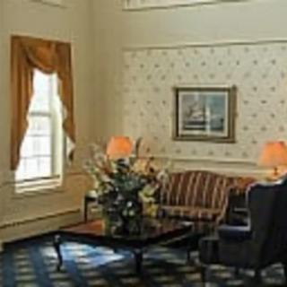 A cozy living room with elegant furniture and decor.